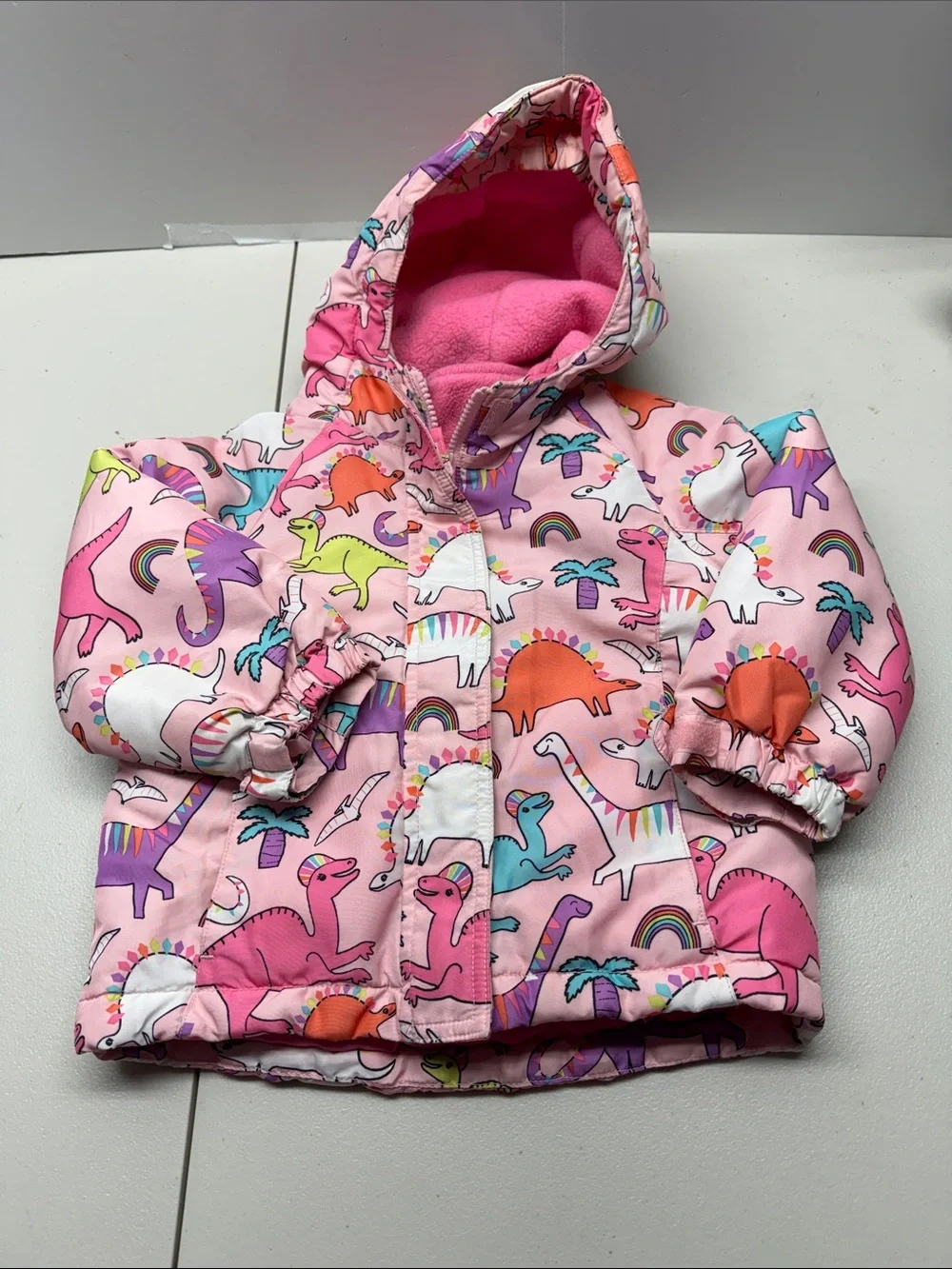 The Children's Place Pink Hooded Puffer Jacket with Colorful Dino Print. Size 3T